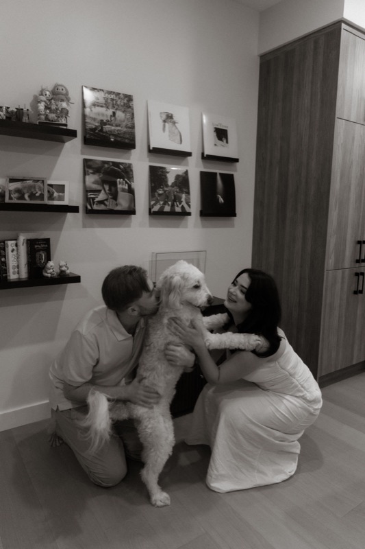 Kaylee and David greeting Monty in the hallway
