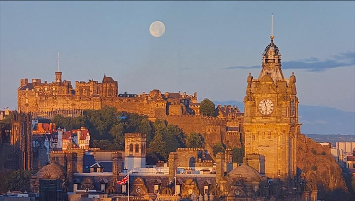 Edinburgh Castle and the Balmoral clock under a full moon